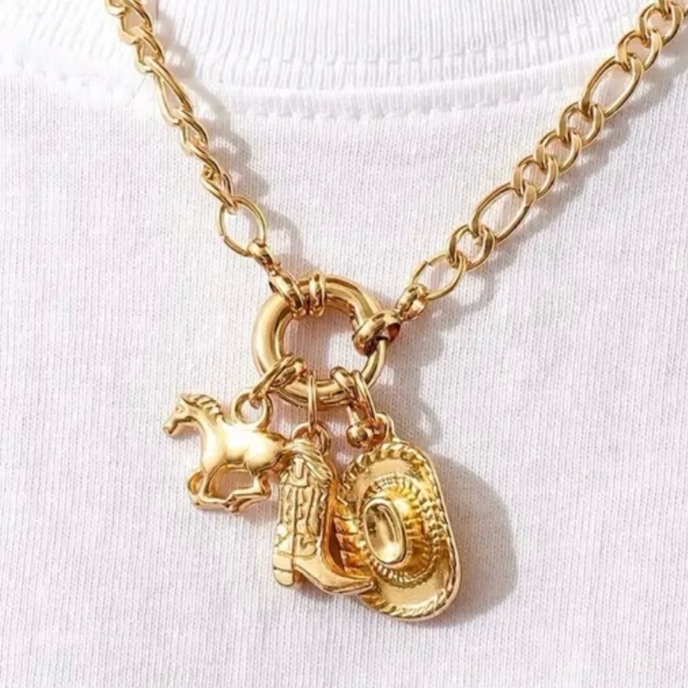 Adorable charm necklace. Cowboy boot, hat and horse charms. Dainty and light.